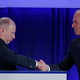 Dixton (left) shakes hands with Boeing chief executive Dennis Muilenburg.